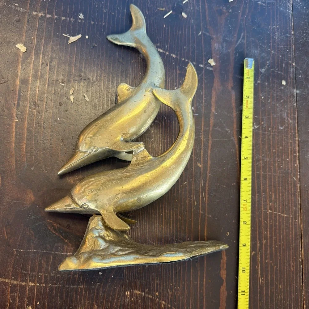 brass dolphin sculpture